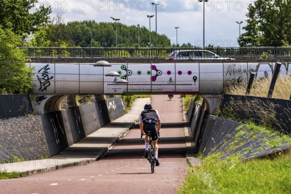 Rijnwaalpad long-distance cycle path, near the village of Elst, subway of the A15 motorway, wide