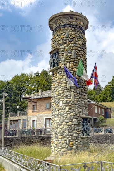 1955 on 1311 m high pass summit of Alpine pass asphalted road pass built round tower erected