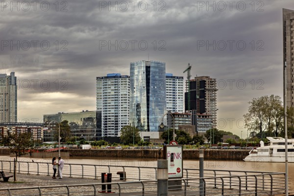 Modern buildings along a river on a cloudy day, urban atmosphere, The skyline of Buenos Aires