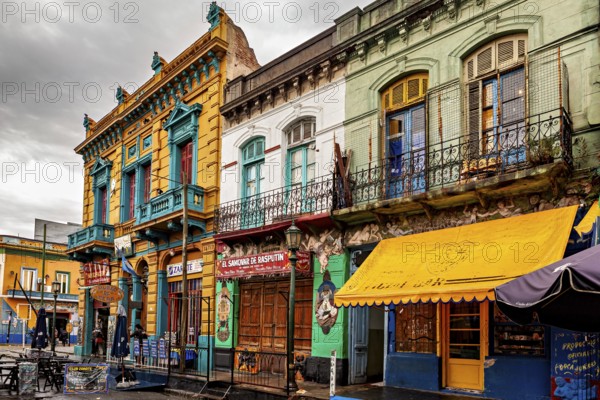 Traditional colourful facades along a cloudy street backdrop, The colourful city and tango district