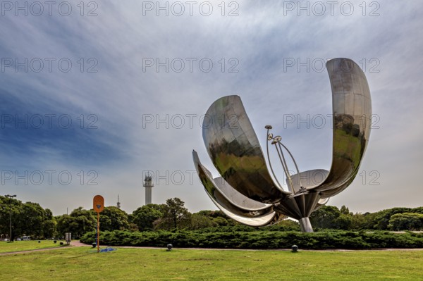Metal flower sculpture in a park under a cloudy sky in daylight, The lotus blossom in Buenos Aires