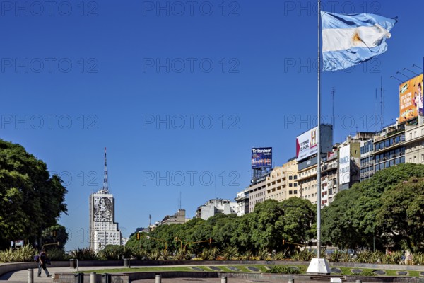 Argentinian flag flies over an urban scenery with buildings and blue sky, The skyline of the city