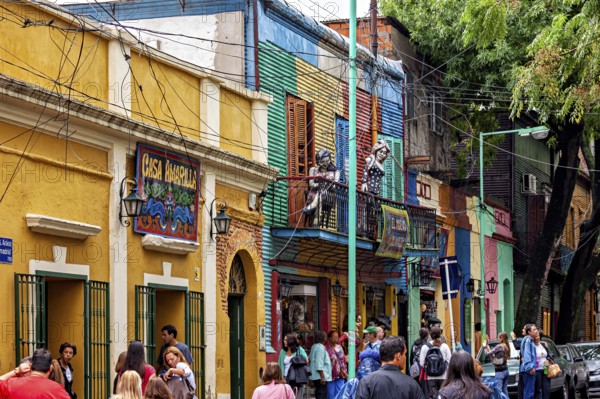 Lively street view with sculptures and colourful buildings in La Boca, the colourful city and tango