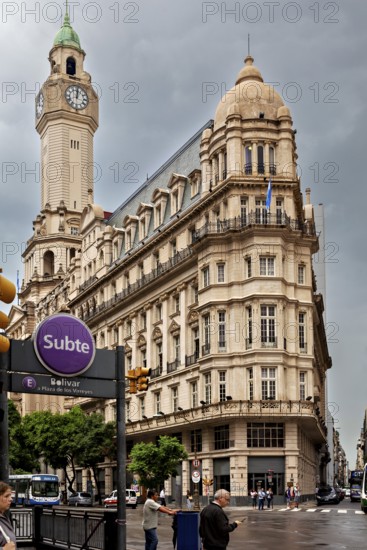 A Subte entrance near an imposing historic building and a striking clock tower, Historic buildings