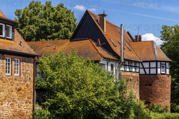 The old town centre with half-timbered houses, church towers and remains of the town wall in