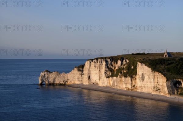 Rock arch Falaise or Porte d'Amont, beach, church Chapelle Notre Dame de la Garde, Étretat, sea,