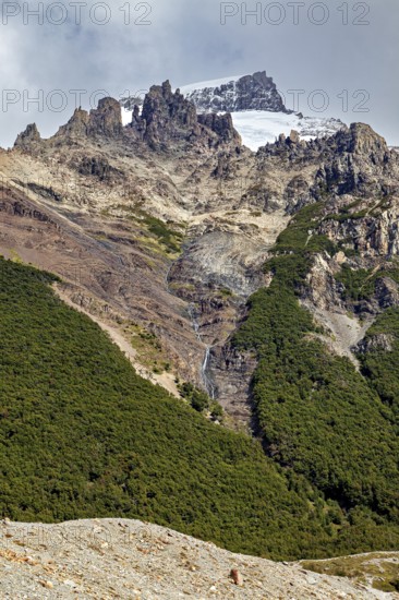 Mountain landscape with snow-covered peak and small waterfall, The landscape of Patagonia in