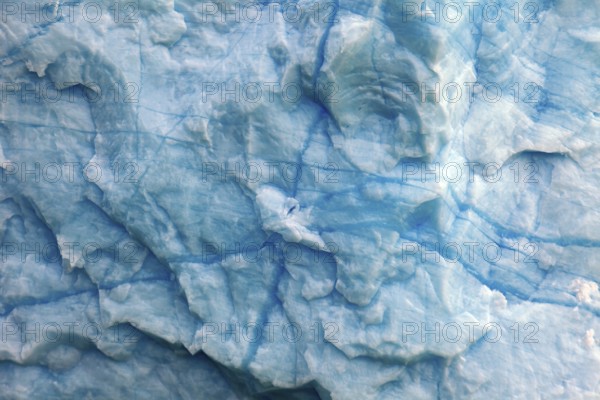 Close-up of the structured ice surface with blue cracks, The blue ice of the Perito Moreno Glacier
