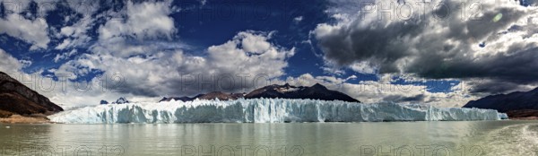 Idyllic panoramic view of a glacier and mountain range under a dynamic sky, The glacier of Perito