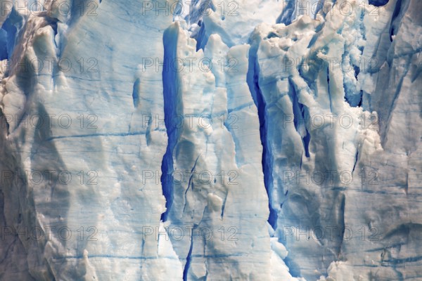 Close-up of a glacier with blue ice texture and visible cracks, The blue ice of the Perito Moreno