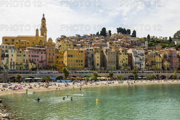 Town with colourful houses by the sea, Plage des Sablettes, Menton, Alpes Maritimes, Provence Alpes