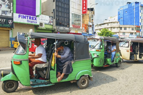 Motorized tuk tuk in a shopping street, Colombo, Sri Lanka