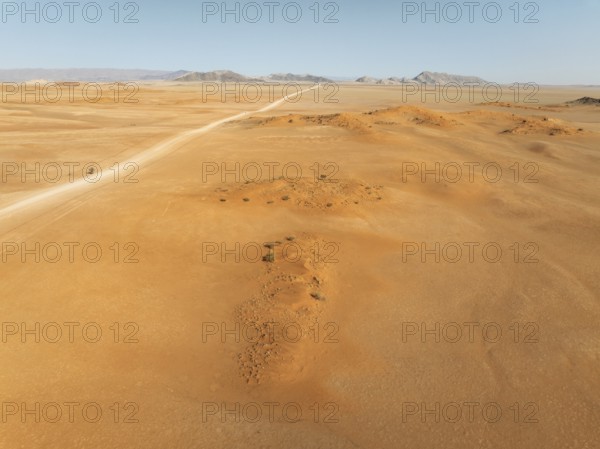 The C14 gravel road at the edge of the Namib Desert. Aerial view. Drone shot. Namibia