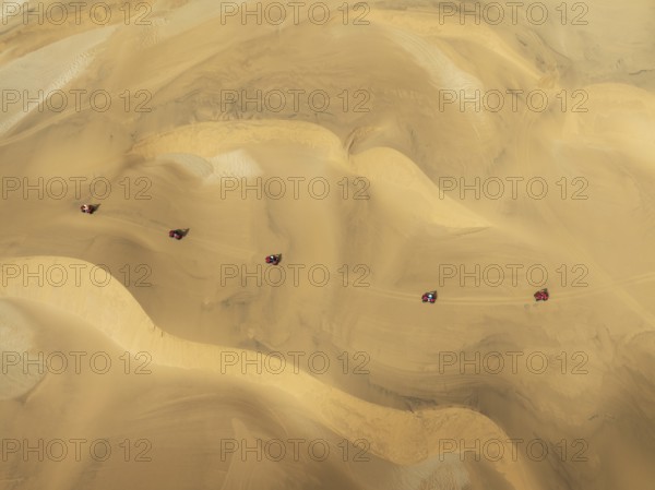 Quad bikes in the dunes of the Namib Desert in the vicinity of the coastal town of Swakopmund.