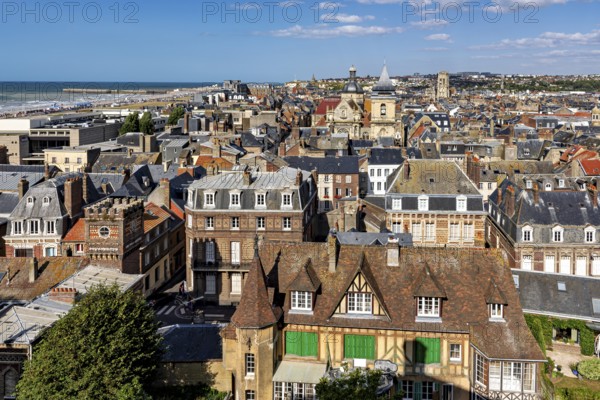 Town view with historic architecture and half-timbered houses on the coast under a blue sky, The
