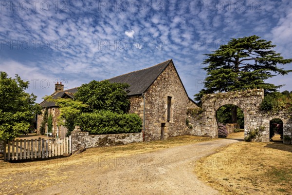 Spacious property with a stone building and archway, surrounded by a rural setting, The Abbey de La