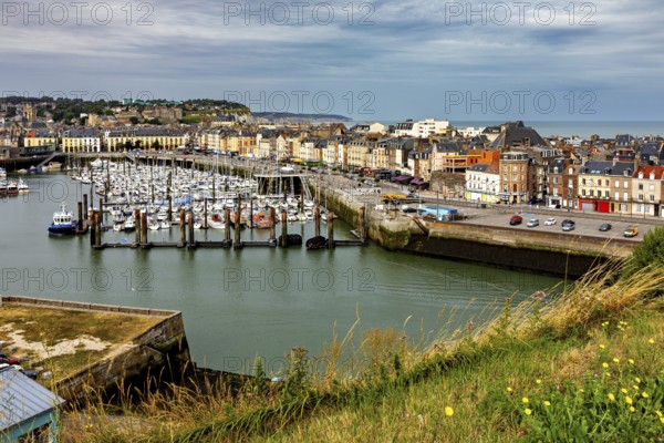 Panoramic view of a harbour and a town from a grassy hill, The harbour of Dieppe in Normandy,