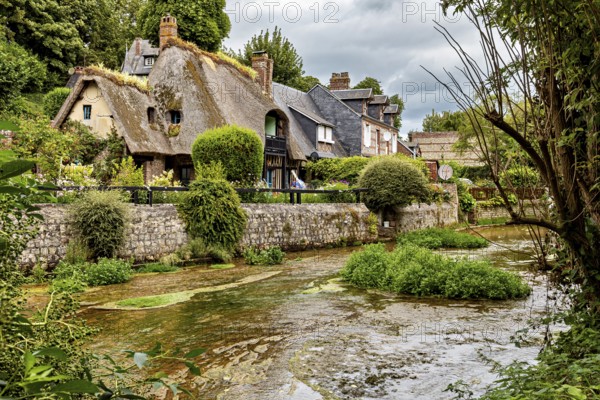Historic cottages near the river nestled in a magnificent green setting, the historic mill village