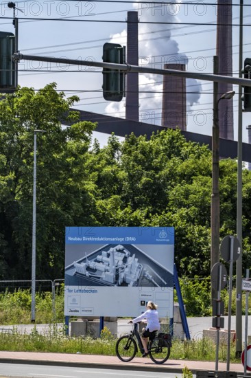 Construction site sign for thyssenkrupp Steel's first direct reduction plant, the climate-neutral