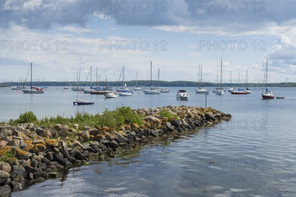 Sailing boats in the harbour, stone jetty, dark clouds, Eckernförde, Baltic Sea,
