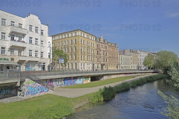 Historic houses on the Robert-Franz-Ring with millrace, stream, bank, Halle an der Saale,