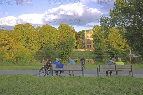 Christian Academy on the Saale and cyclist resting on a bench, leisure, relax, break, rest, enjoy,