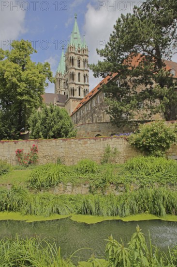 Late Romanesque UNESCO Cathedral of St Peter and St Paul with twin towers and cathedral garden,