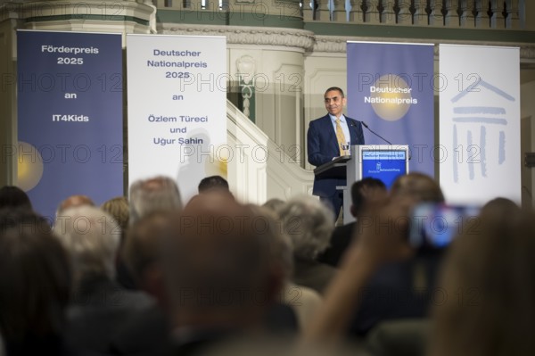 Ugur Sahin (founder of Biontech SE) gives an acceptance speech after receiving the German National