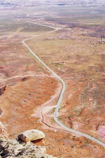 Winding roadway cutting through Valley of the Gods, Utah, USA