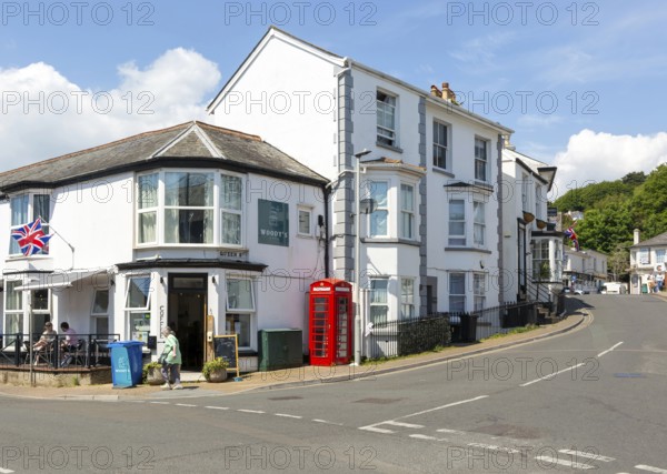 Historic buildings old red telephone box, Woody's cafe, Queen Street, Dawlish, south Devon,