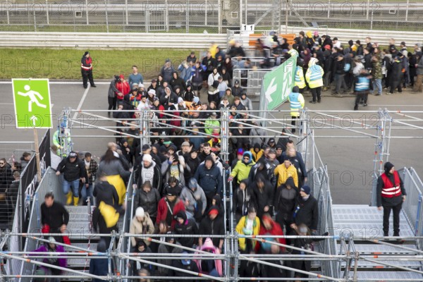 Festival visitors stream via separate entrances to the front breakwaters in front of the Utopia