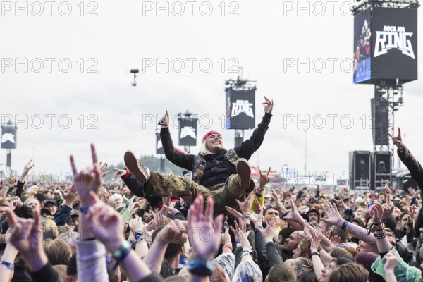 Festival visitor crowdsurfing at the Rock am Ring Festival on Friday, Nürburgring race track race