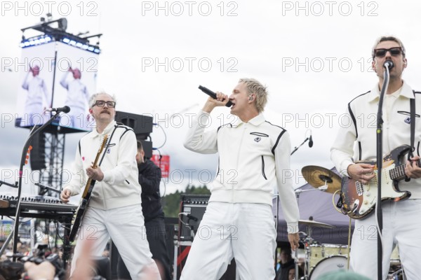 Steffen Israel (guitarist and keyboarder), Felix Brummer (singer) and Karl Schumann (guitarist) of