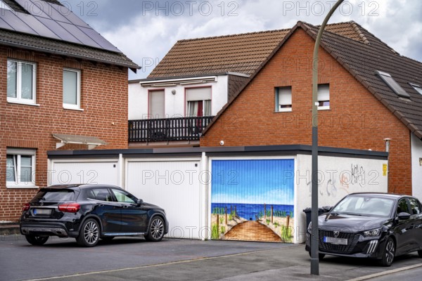 Residential neighbourhood, residential street in Dortmund-Marten, multi-family houses, garages, one