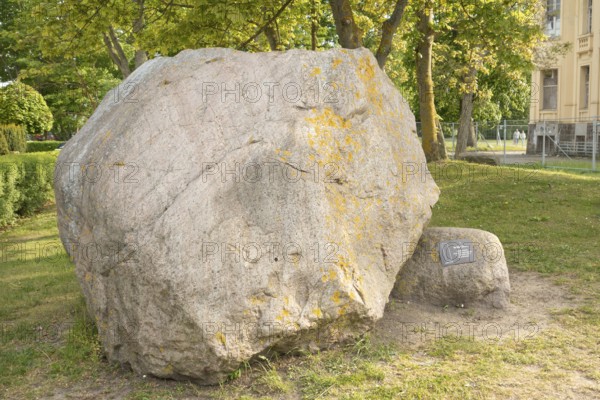 Giant boulder red gneiss (meta-granite), beach promenade, Baltic resort Kühlungsborn, West