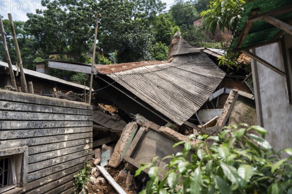 A damaged house after a major landslide, triggered by a heavy downpour, in Guwahati, India, on June
