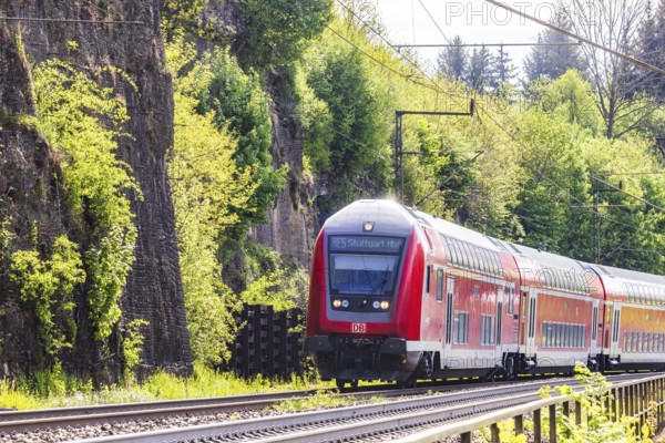 Regional express RE5 en route on the winding railway line of the Geislinger Steige. Landscape along