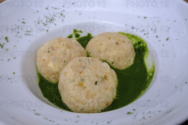 Dumplings on herbs, at Rifugio Ra Stua, Ra Stua Alm, Valon Scuro, near Cortina d'Ampezzo,