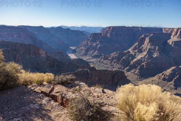 Colorado River runs between rock formations at Guano Point in Grand Canyon West near Peach Springs,