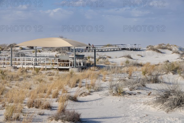 Fabric awning over a portion of the Interdune Boardwalk provides some shade for visitors at White