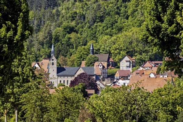 Idyllic village with a church and surrounded by green hills and dense forests, the town of Treffurt