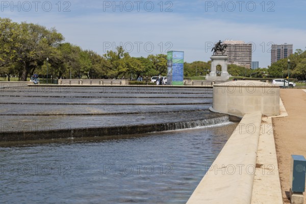 Bronze sculpture of Sam Houston behind the Mary Gibbs and Jesse H. Jones Reflection Pool at Hermann