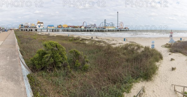 Sand beach near the Galveston Island Historic Pleasure Pier on the Texas Gulf Coast at Galveston,