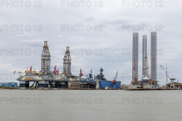 Drilling rigs docked for repairs in the Port of Galveston, Texas