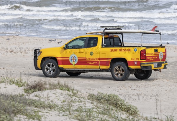 Galveston Island Beach Patrol truck on the beach of the Texas Gulf Coast at Galveston, Texas