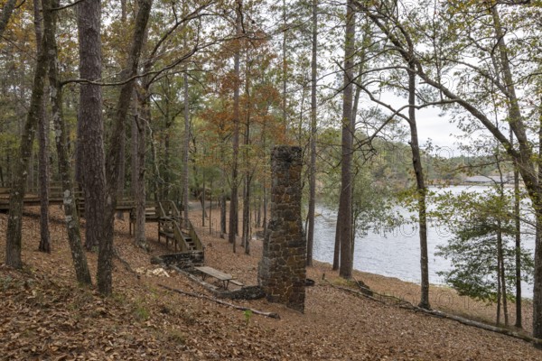 Fireplace chimney remains of a cabin used as a picnic site on the shore of Ivy Lake at Clarko State