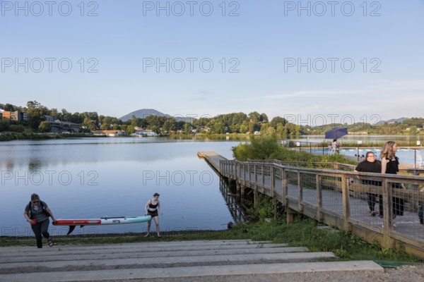 Women take a wake board out of the lake at Lake Junaluska, North Carolina