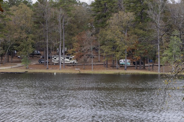 Modern and retro recreational vehicles at the campground near the shore of Ivy Lake in Clarko State