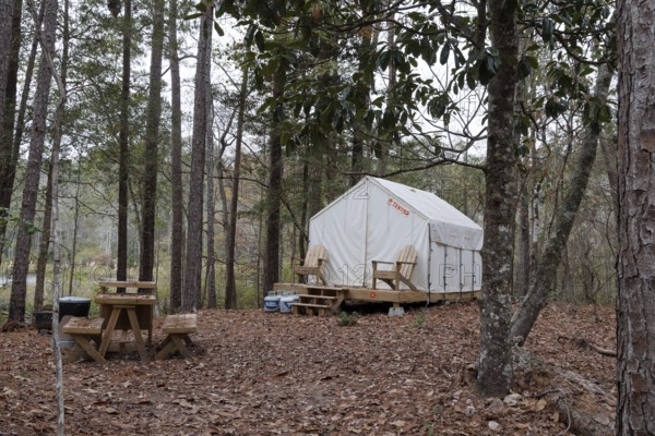 Tentrr glamping tent on a raised platform with a wooden porch at Clarko State Park near Quitman,