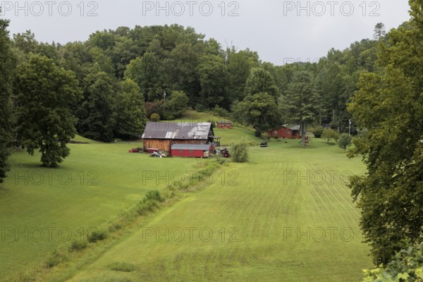 Small family farm in the mountains as seen from the open air car of the Great Smoky Mountains